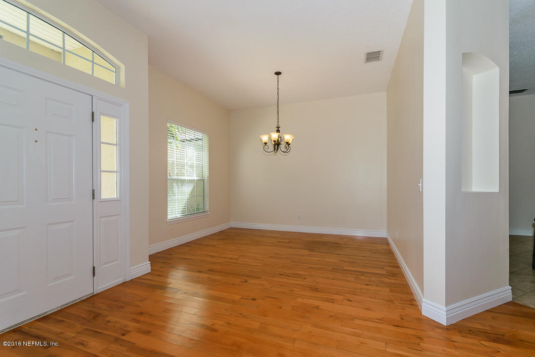 4329 Rye Court St. Johns, FL 32259 - Photo 4 of 25 a view of empty room with wooden floor and fan
