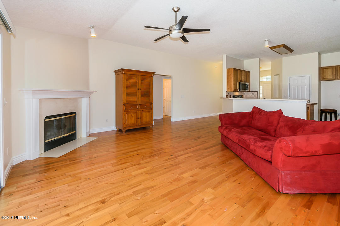 4329 Rye Court St. Johns, FL 32259 - Photo 7 of 25 a living room with furniture and a fireplace