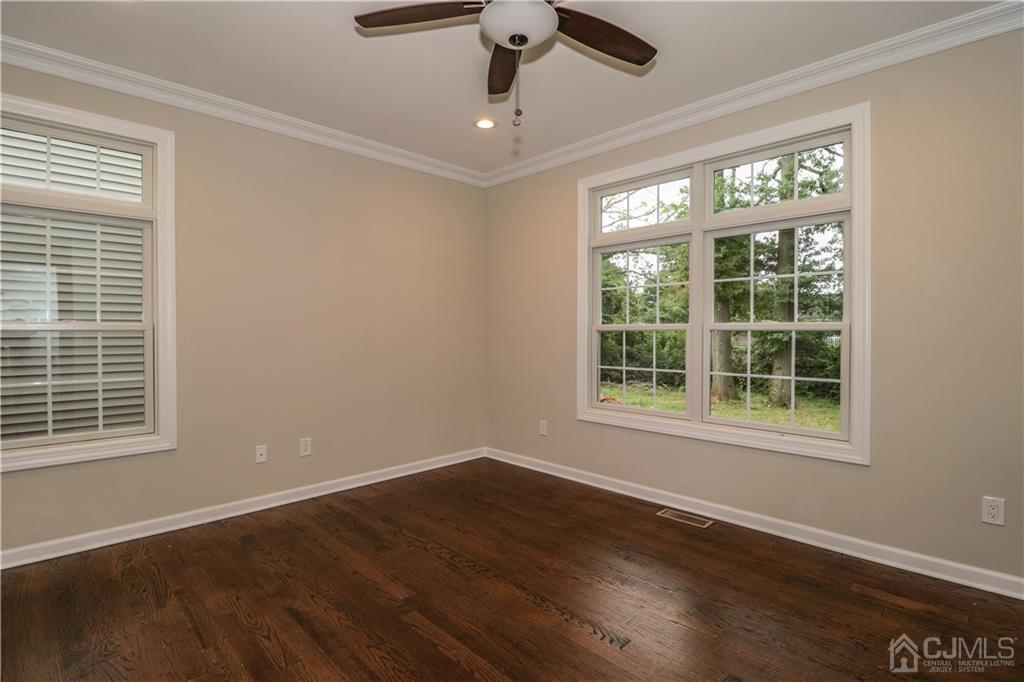 59 Middlesex Avenue Edison, NJ 08820 - Photo 11 of 25 a view of an empty room with wooden floor and a window