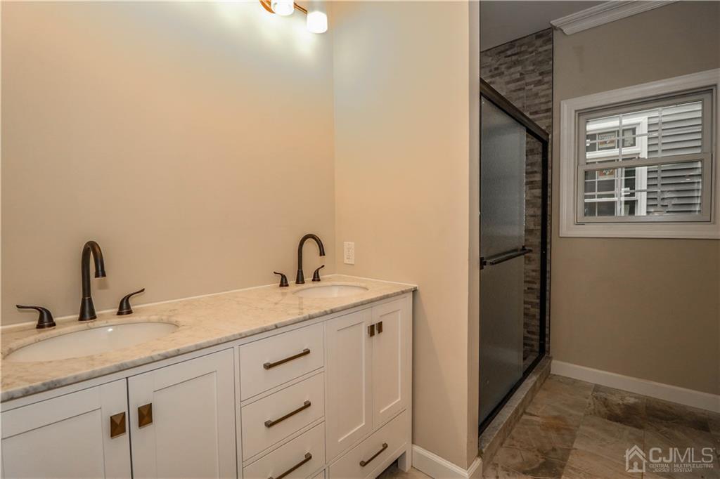 59 Middlesex Avenue Edison, NJ 08820 - Photo 13 of 25 a bathroom with a sink and vanity