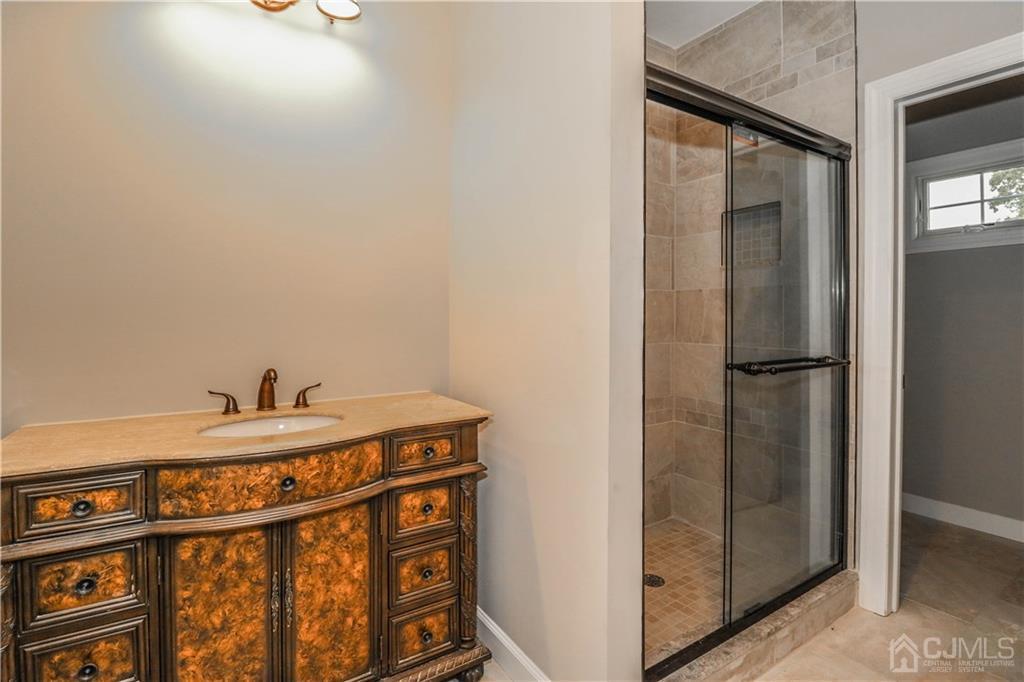 59 Middlesex Avenue Edison, NJ 08820 - Photo 20 of 25 a bathroom with a sink and a mirror