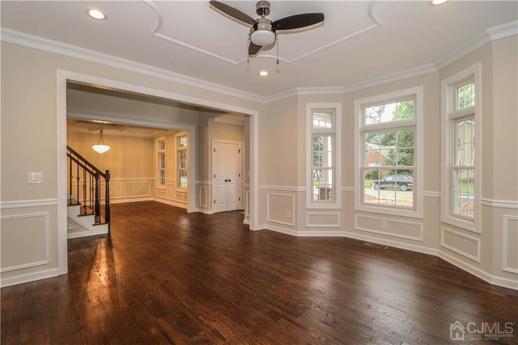 59 Middlesex Avenue Edison, NJ 08820 - Photo 6 of 25 a view of an empty room with wooden floor and a window