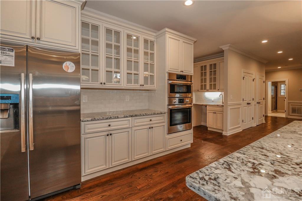 59 Middlesex Avenue Edison, NJ 08820 - Photo 9 of 25 a kitchen with stainless steel appliances granite countertop a refrigerator and a stove top oven