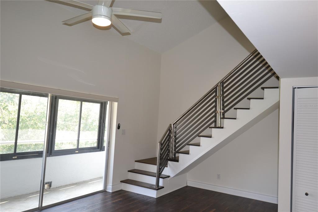 2585 Countryside Boulevard, Unit 4307 Clearwater, FL 33761 - Photo 17 of 32 a view of staircase with white walls and windows