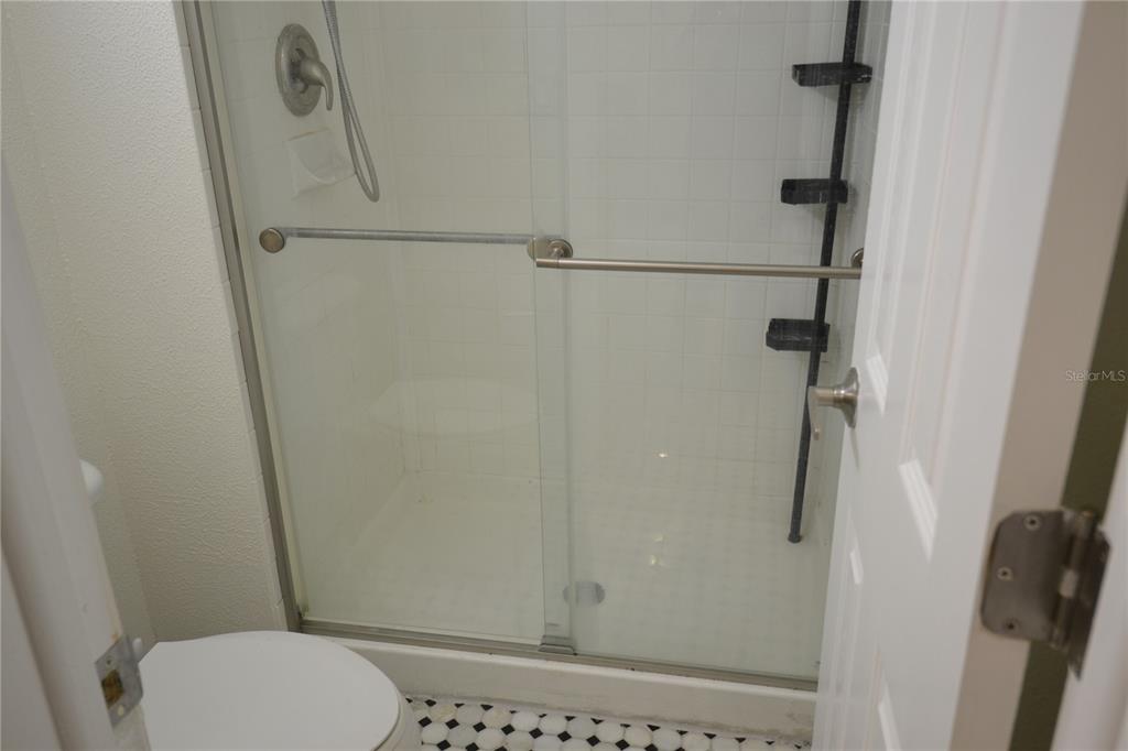 2585 Countryside Boulevard, Unit 4307 Clearwater, FL 33761 - Photo 23 of 32 a bathroom with a shower toilet and sink