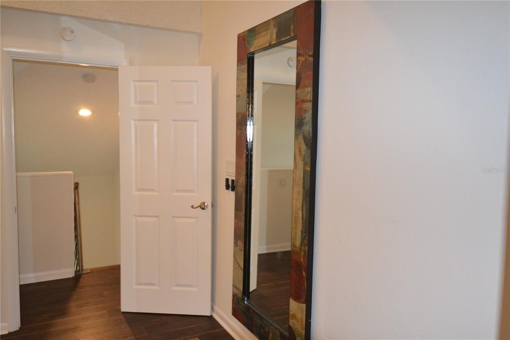 2585 Countryside Boulevard, Unit 4307 Clearwater, FL 33761 - Photo 29 of 32 an empty room with wooden floor and entrance