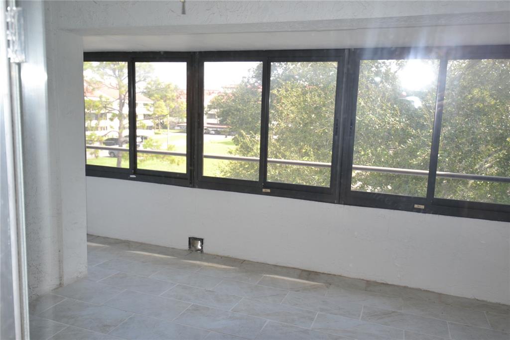 2585 Countryside Boulevard, Unit 4307 Clearwater, FL 33761 - Photo 5 of 32 a room with a large window