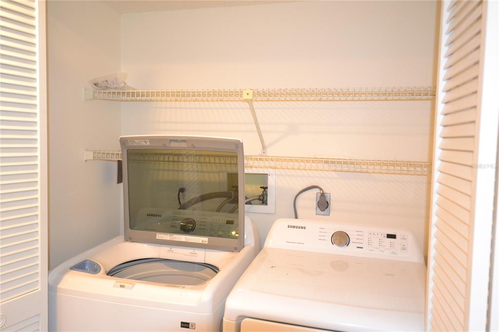 2585 Countryside Boulevard, Unit 4307 Clearwater, FL 33761 - Photo 6 of 32 a bathroom with a tub and shower