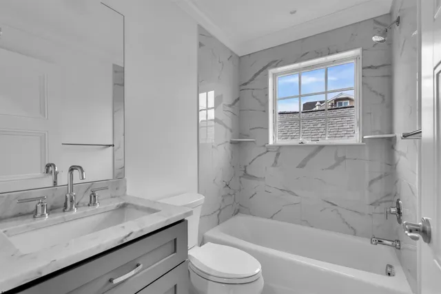 a view of kitchen with stainless steel appliances granite countertop a stove top oven a sink and a dishwasher with wooden floor