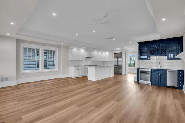 a view of an empty room with a fireplace