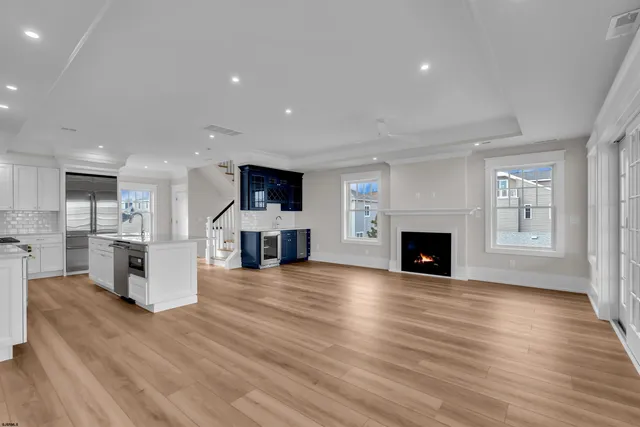 a view of an empty room and wooden floor