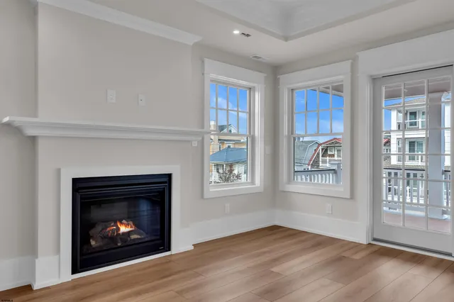 a view of a terrace with a flat tv screen and a floor to ceiling window