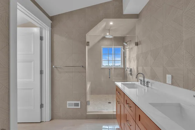 a view of a storage and utility room with washer and dryer