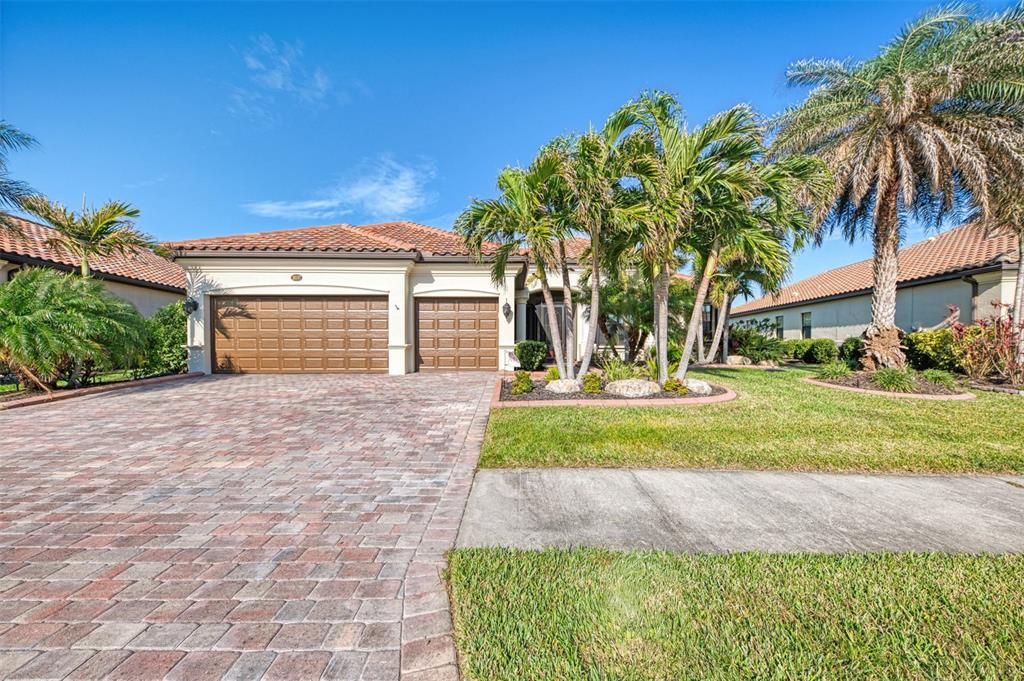 3 Car Garage and Lush Landscaping