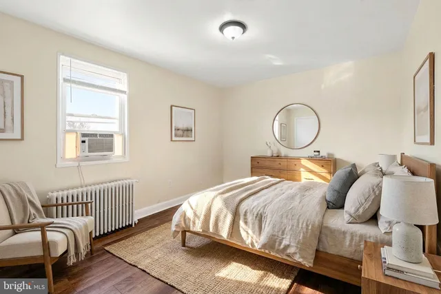 a bed room with a bed and a window