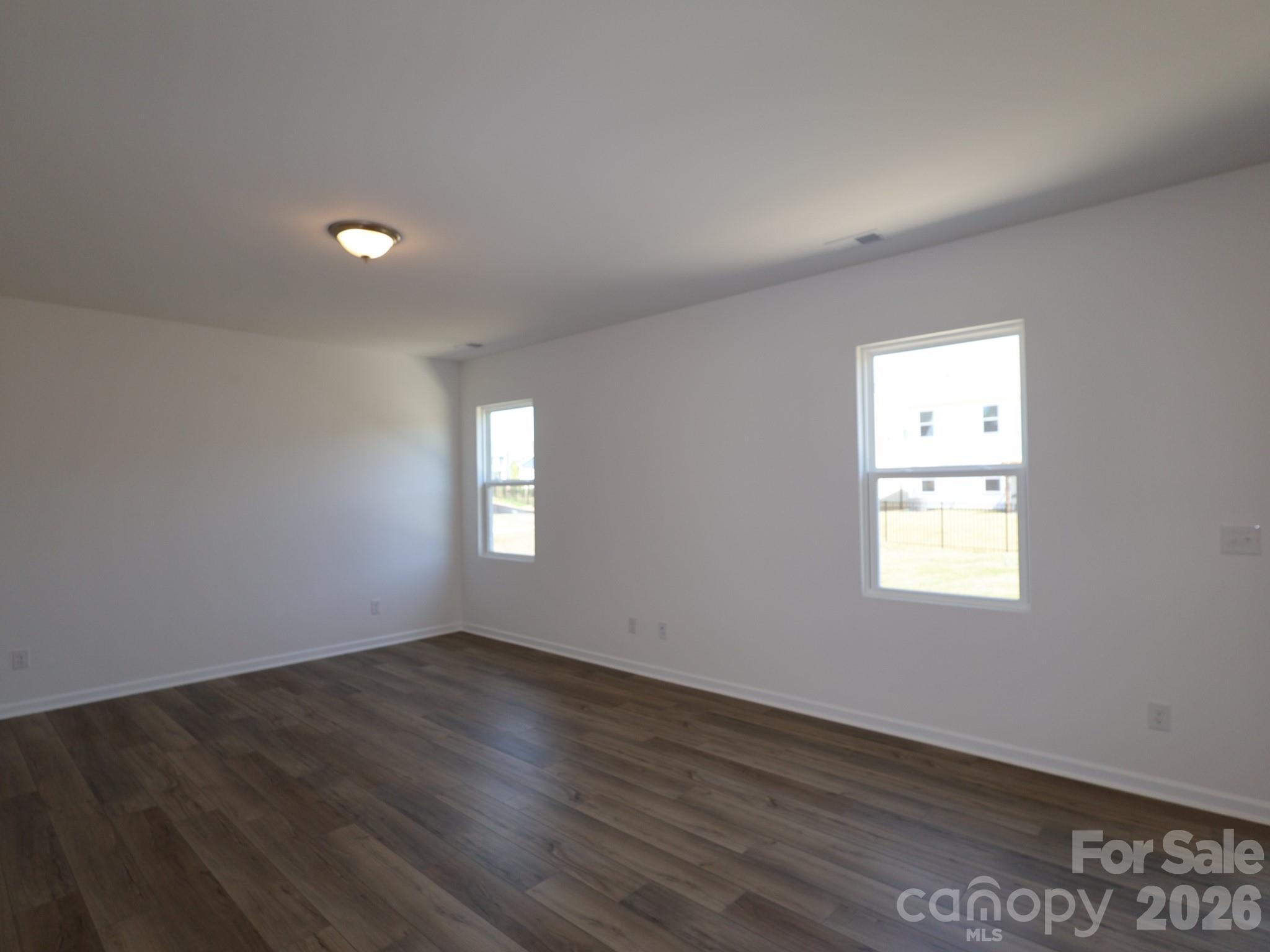 2015 Uplands Road Sherrills Ford, NC 28673 - Photo 3 of 19 an empty room with wooden floor and windows