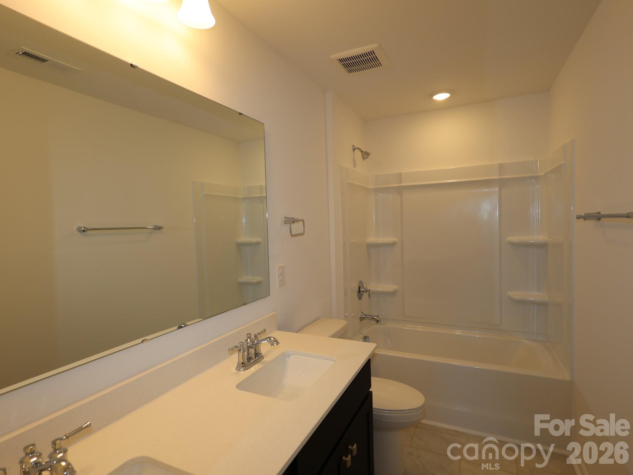 2015 Uplands Road Sherrills Ford, NC 28673 - Photo 9 of 19 a bathroom with a sink a toilet and shower