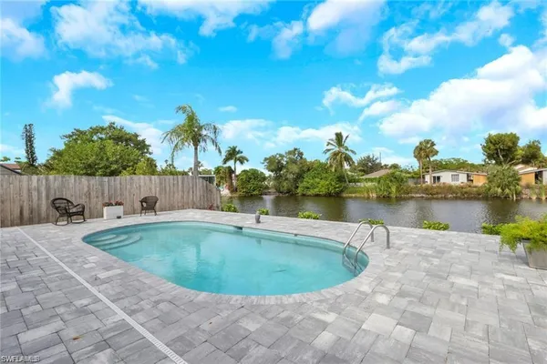 a view of a swimming pool and lake view
