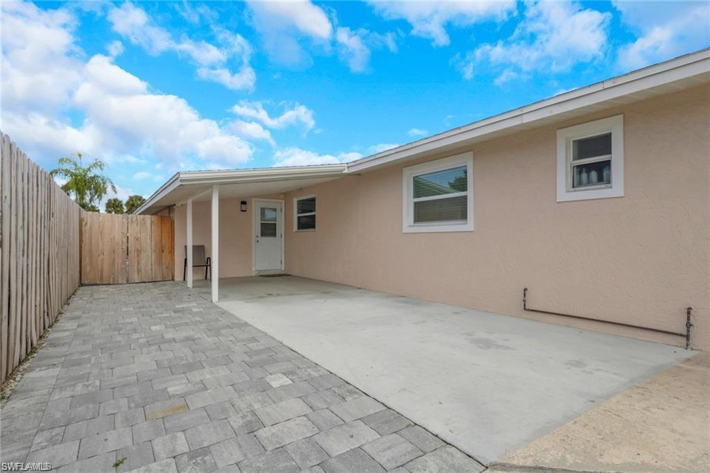 829 107th Avenue North Naples, FL 34108 - Photo 23 of 34 a view of a house with a backyard