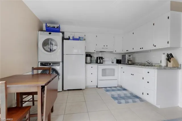 a kitchen with cabinets and window