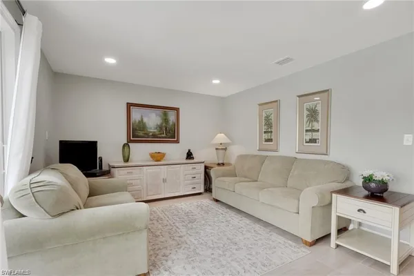 a living room with furniture and a couch