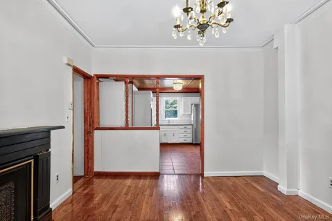 a kitchen with cabinets and window