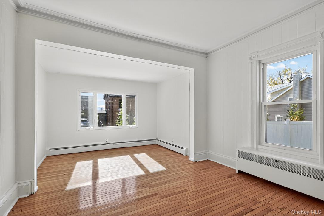 15 Paye Avenue Beacon, NY 12508 - Photo 18 of 36 a view of an empty room with wooden floor and a window