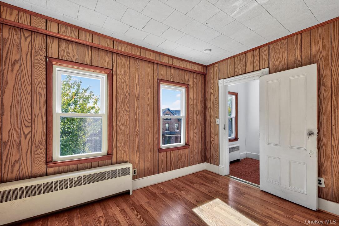 15 Paye Avenue Beacon, NY 12508 - Photo 23 of 36 an empty room with wooden floor and windows