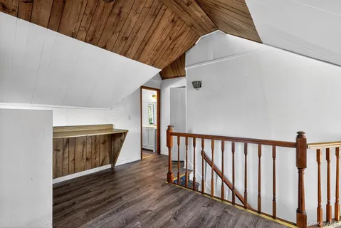 a view of a room with stairs and a ceiling fan
