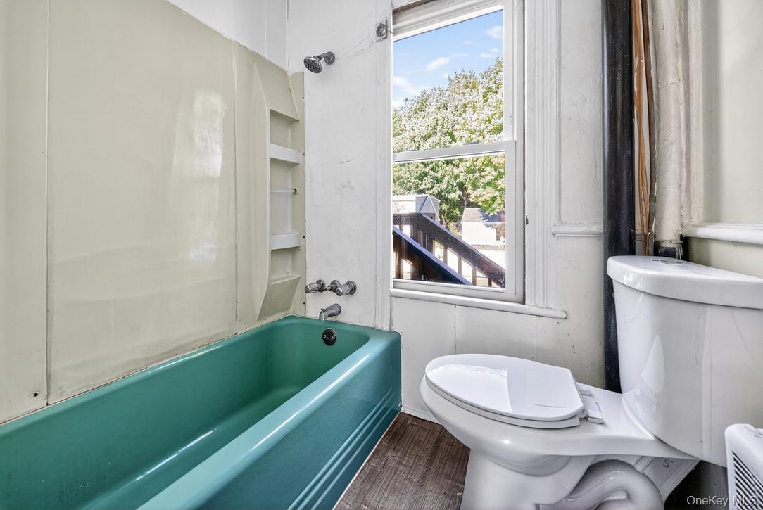 15 Paye Avenue Beacon, NY 12508 - Photo 25 of 36 a bathroom with a toilet a sink and a bathtub