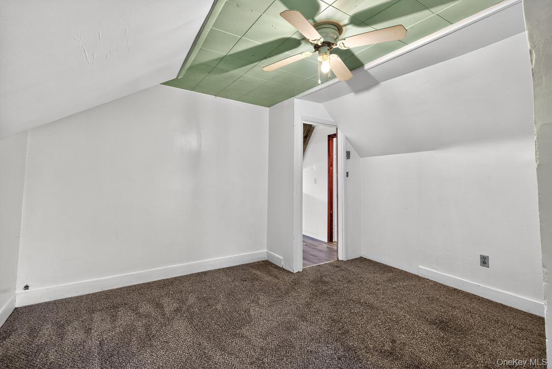 15 Paye Avenue Beacon, NY 12508 - Photo 26 of 36 a view of a room with stairs and a ceiling fan