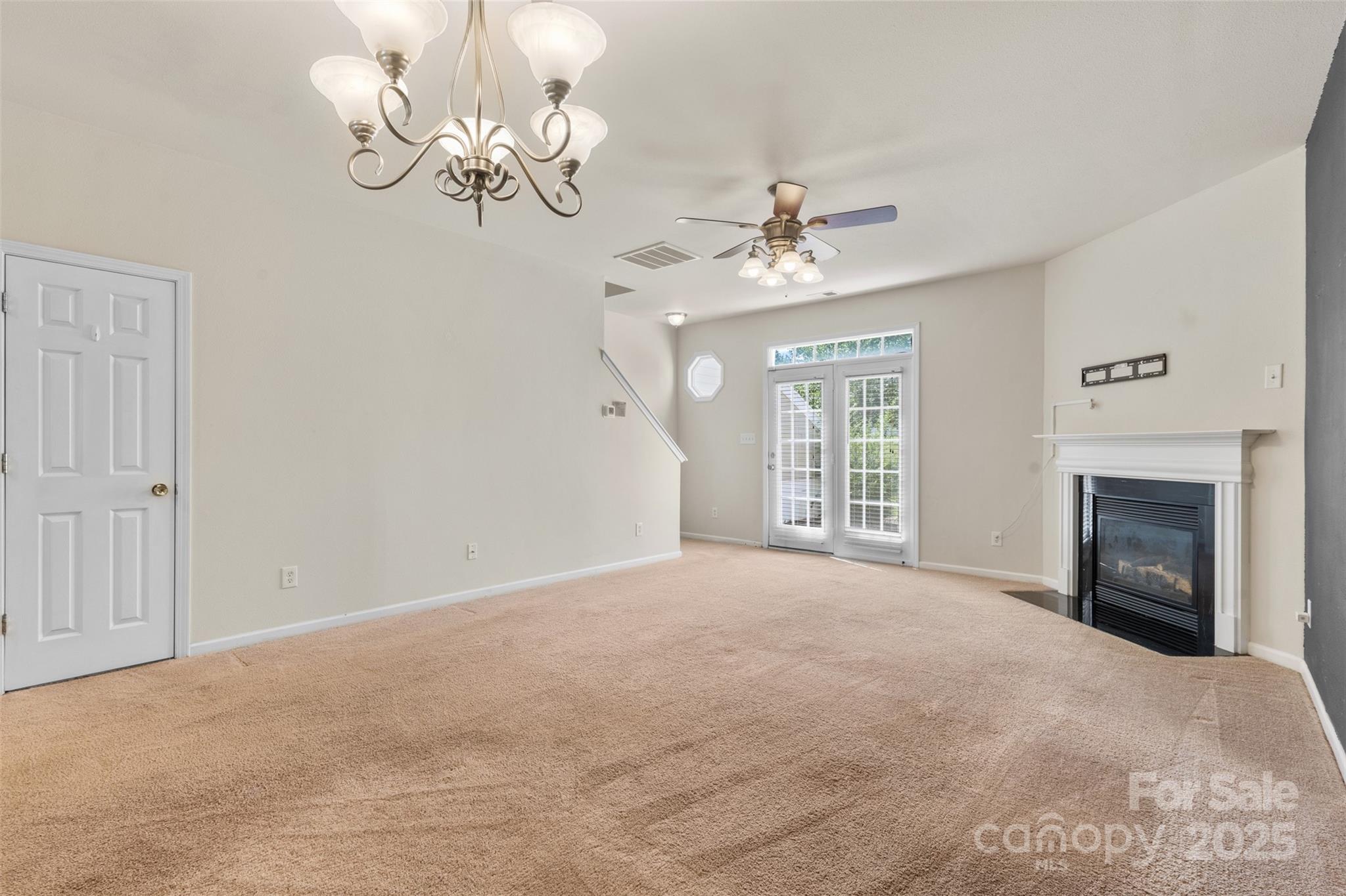 6320 Rhodins Lane Fort Mill, SC 29707 - Photo 11 of 33 a view of an empty room with a fireplace