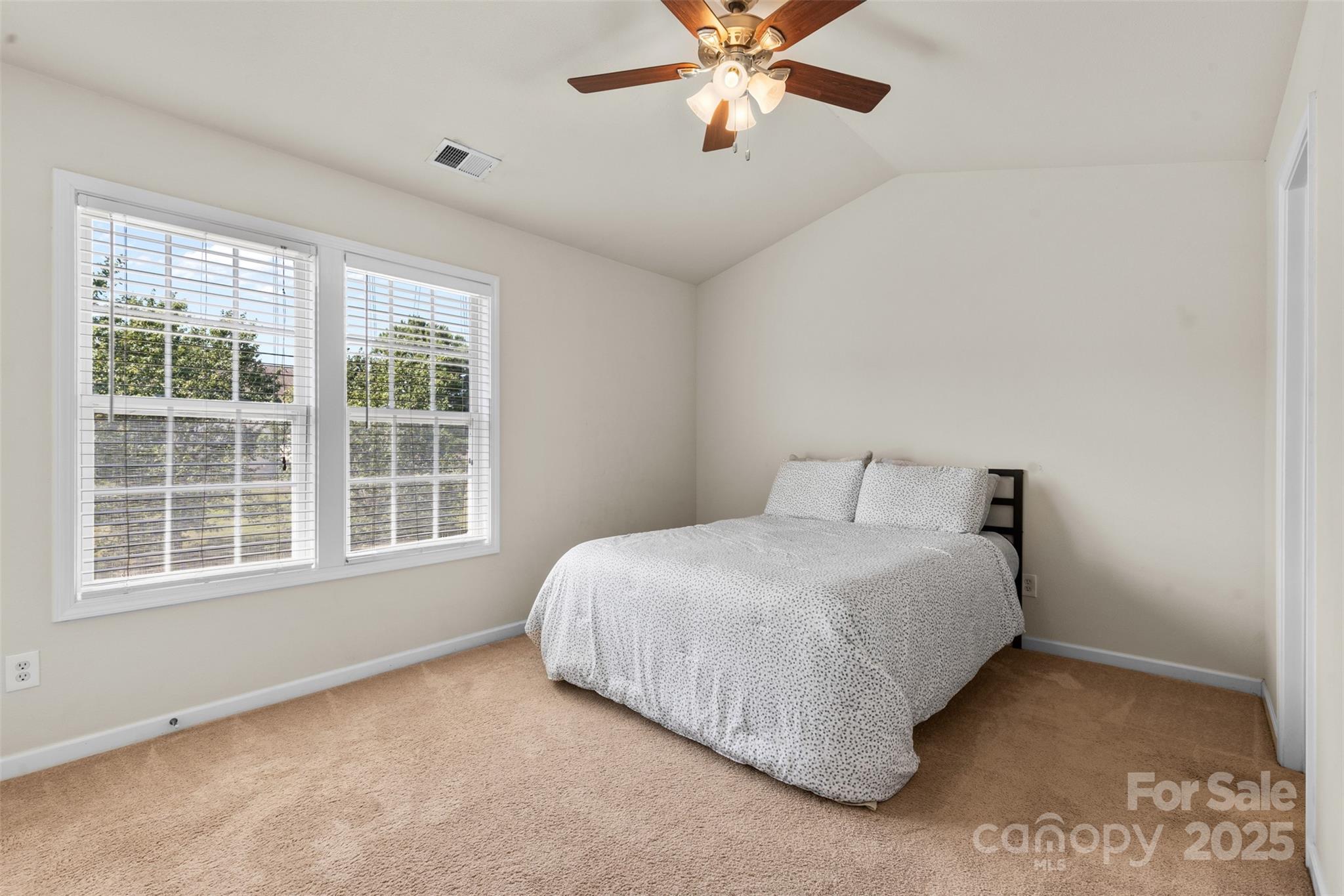 6320 Rhodins Lane Fort Mill, SC 29707 - Photo 13 of 33 a bedroom with a bed and a window