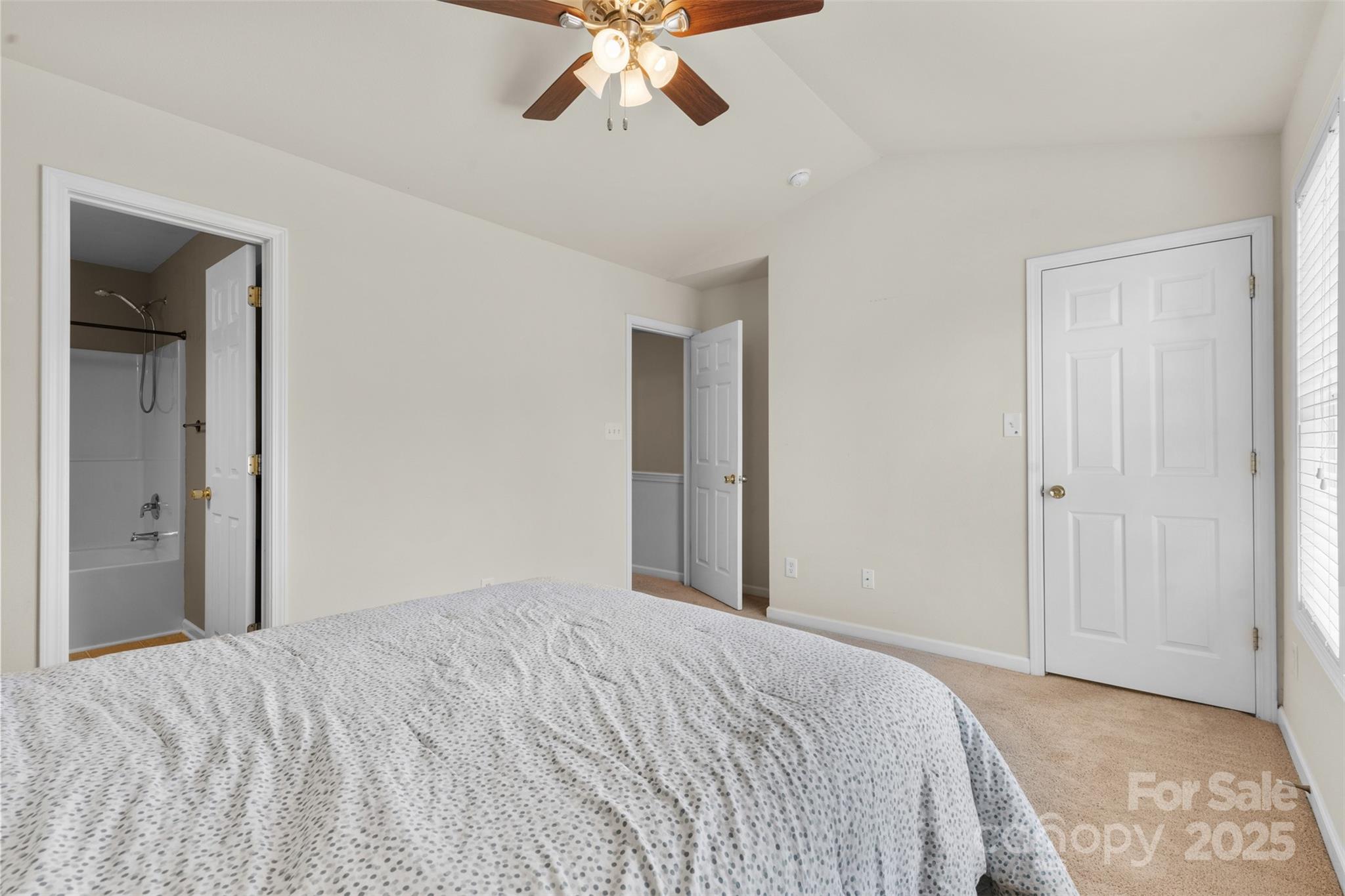 6320 Rhodins Lane Fort Mill, SC 29707 - Photo 15 of 33 a bedroom with a bed and a chandelier