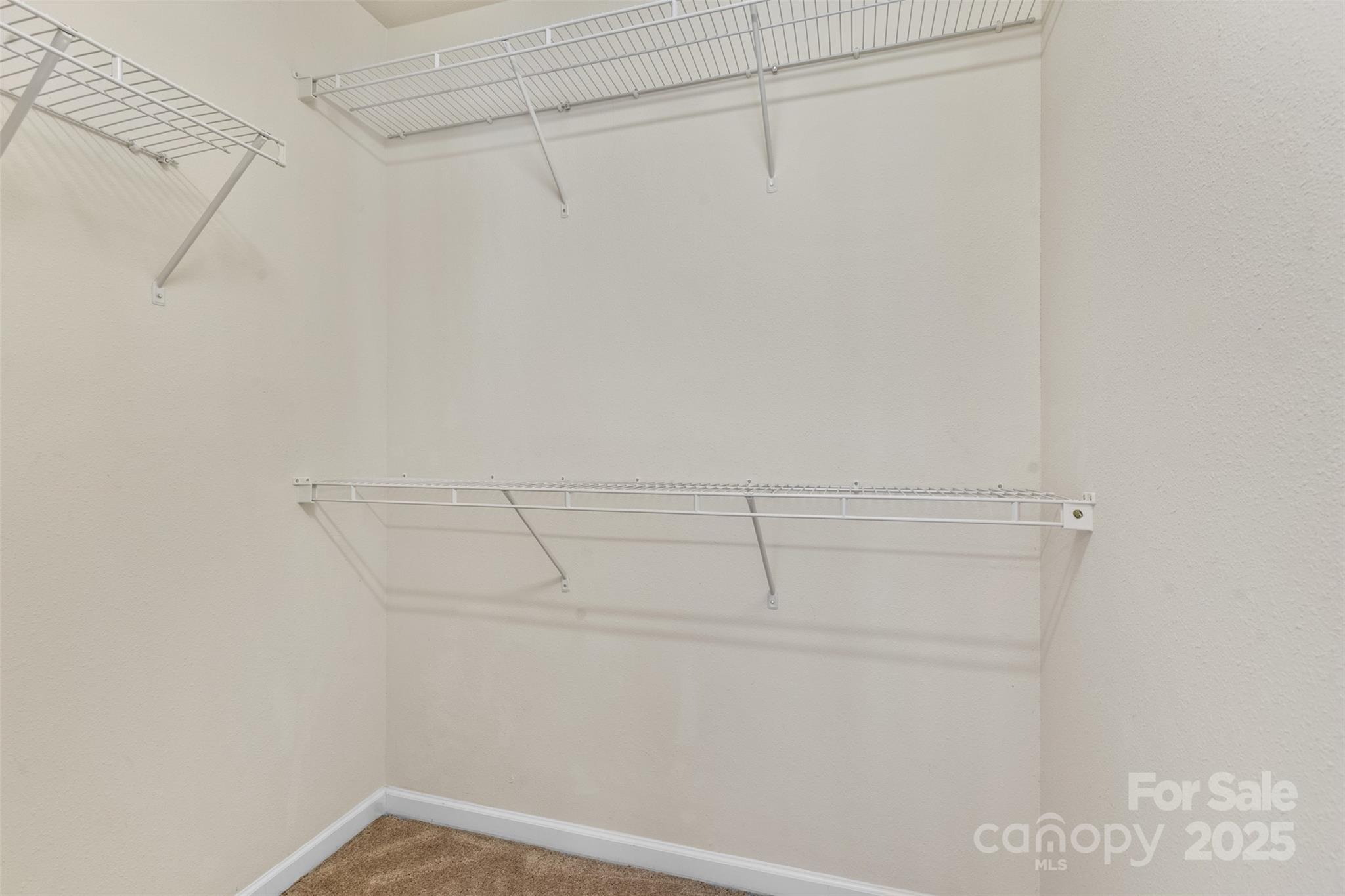 6320 Rhodins Lane Fort Mill, SC 29707 - Photo 16 of 33 a view of a room with racks on the wall