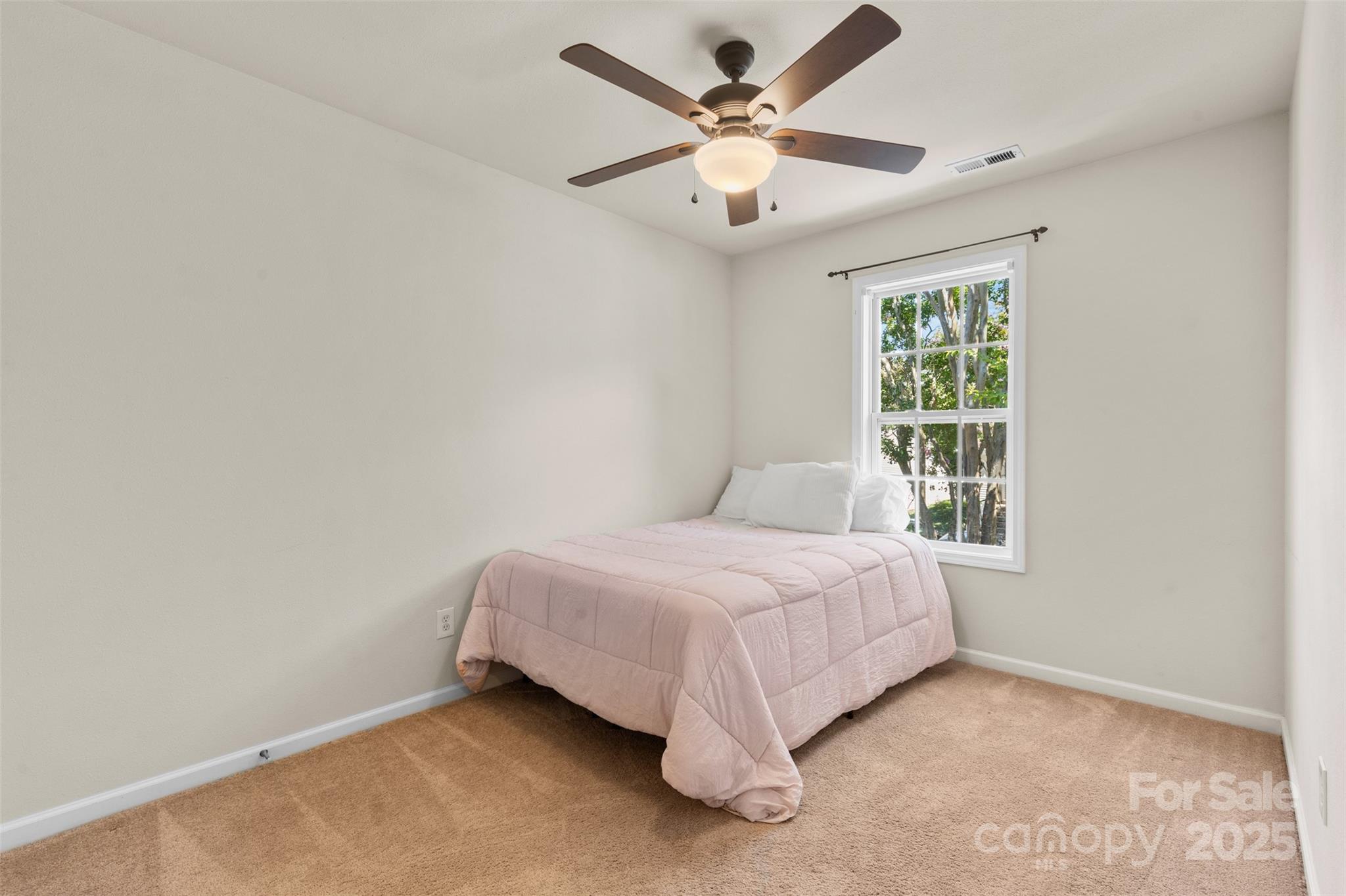 6320 Rhodins Lane Fort Mill, SC 29707 - Photo 18 of 33 a bedroom with a bed and a window