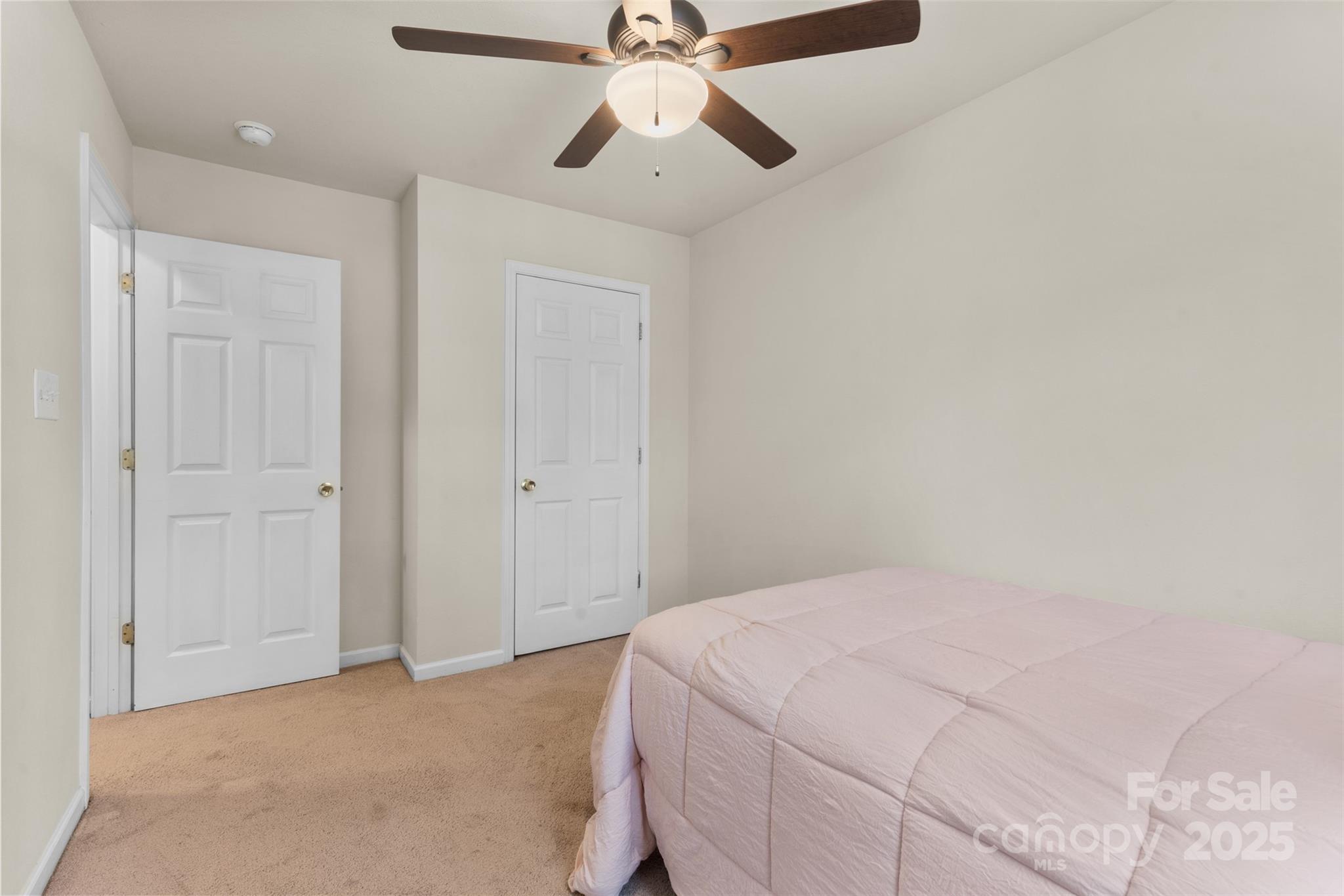 6320 Rhodins Lane Fort Mill, SC 29707 - Photo 19 of 33 a bedroom with a bed and a chandelier