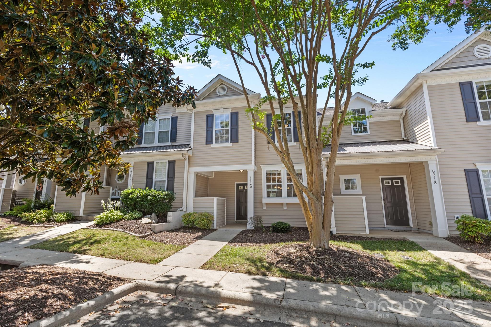 6320 Rhodins Lane Fort Mill, SC 29707 - Photo 2 of 33 a front view of a house with a yard