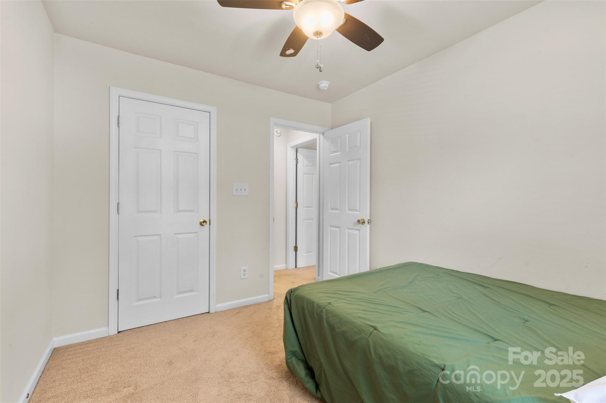 6320 Rhodins Lane Fort Mill, SC 29707 - Photo 21 of 33 a bedroom with a bed and a chandelier