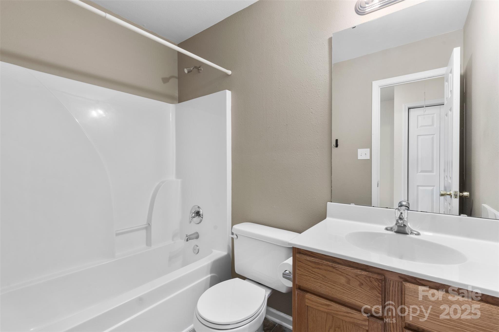 6320 Rhodins Lane Fort Mill, SC 29707 - Photo 22 of 33 a bathroom with a sink toilet vanity and shower