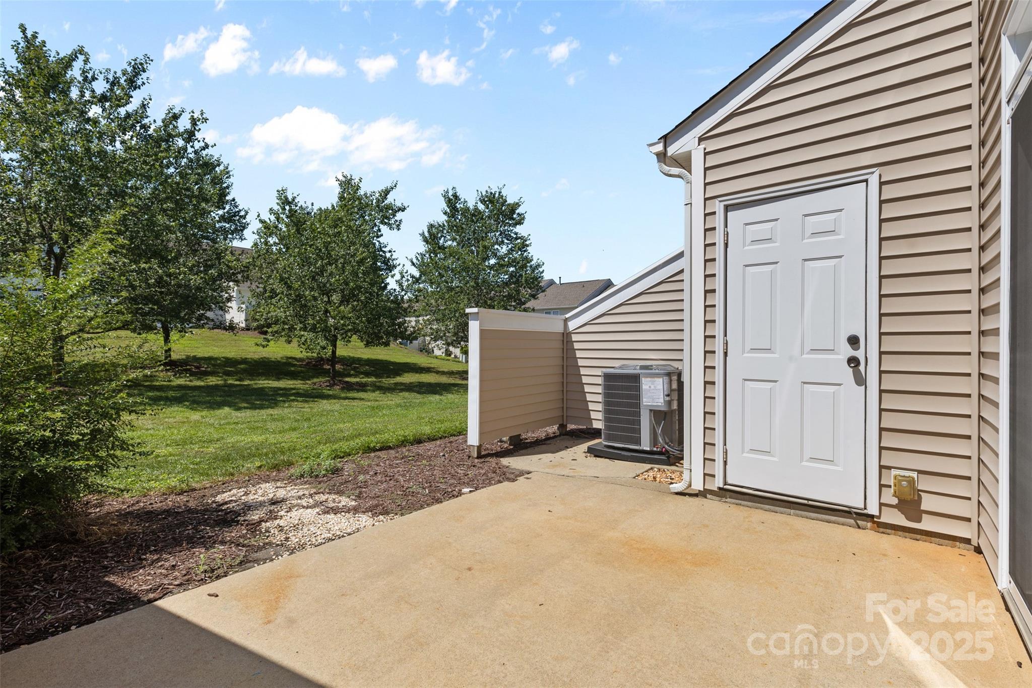 6320 Rhodins Lane Fort Mill, SC 29707 - Photo 25 of 33 a view of a house with backyard and trees