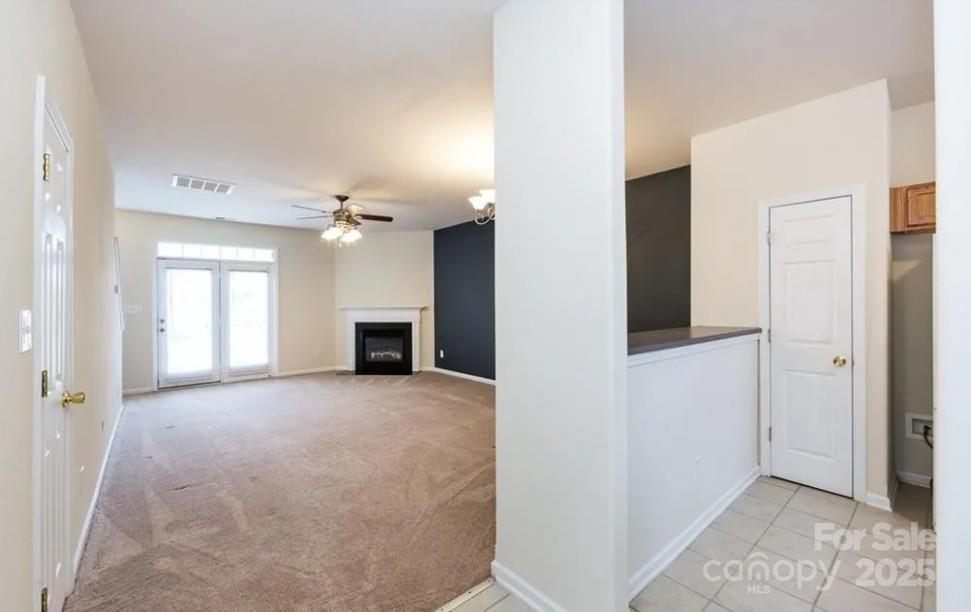 6320 Rhodins Lane Fort Mill, SC 29707 - Photo 3 of 33 a view of a big room with closet and a fireplace