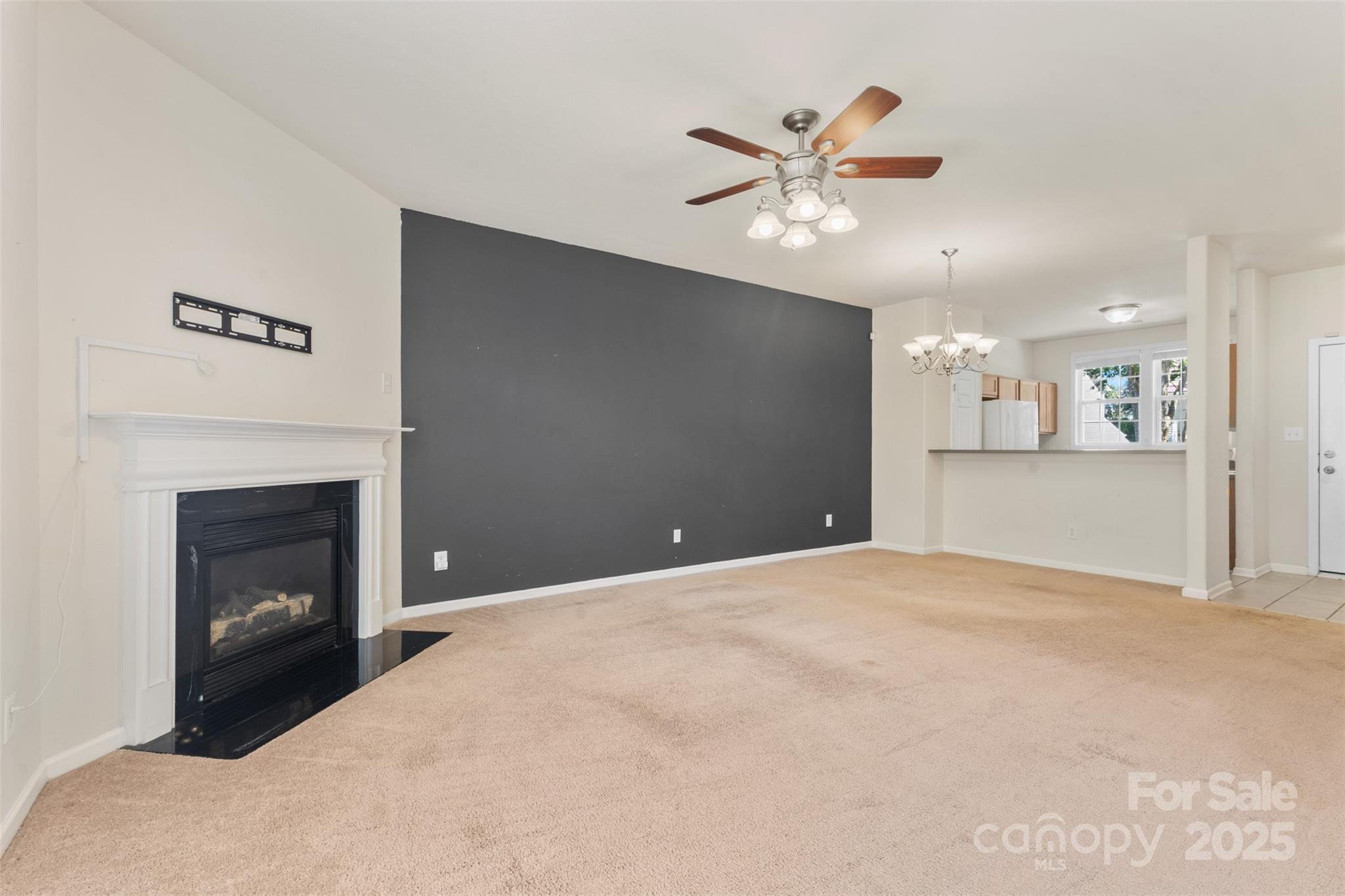 6320 Rhodins Lane Fort Mill, SC 29707 - Photo 10 of 33 a view of an empty room with a fireplace
