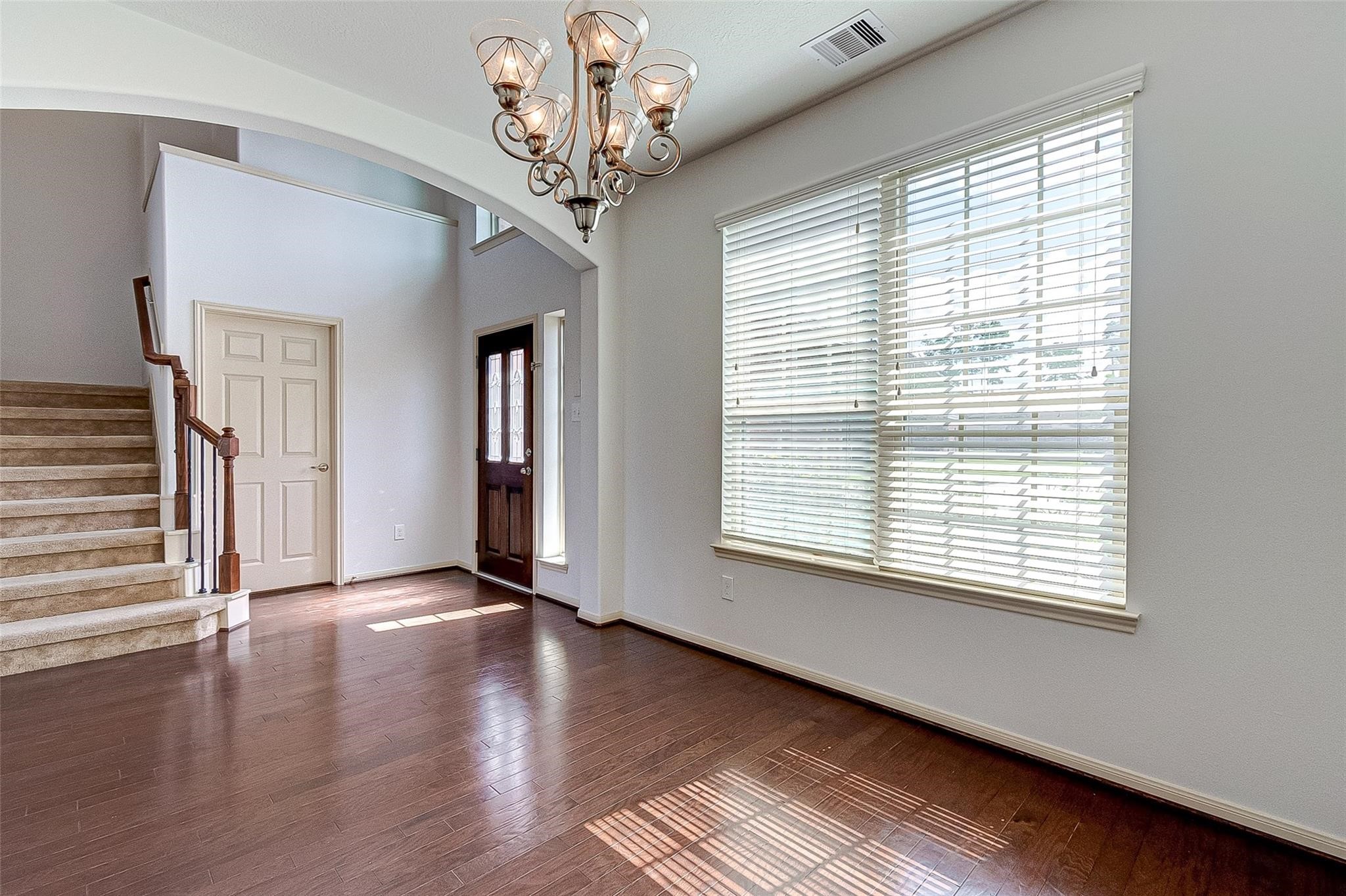 79 West Lasting Spring Circle Spring, TX 77389 - Photo 12 of 48 a view of a livingroom with wooden floor and a large window