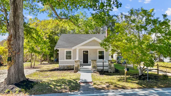 a view of a house with swimming pool and sitting area