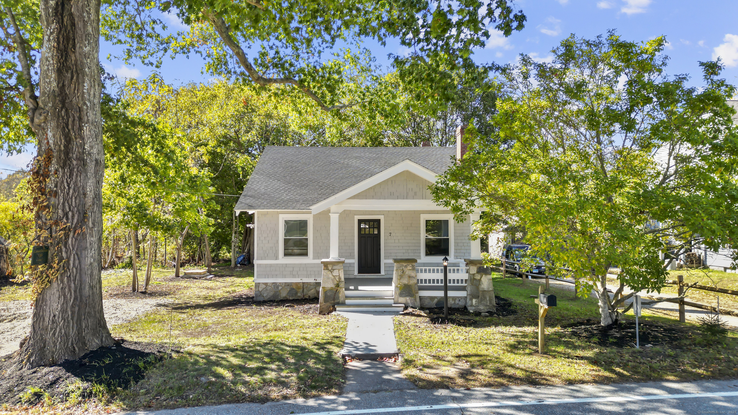 a view of a house with swimming pool and sitting area