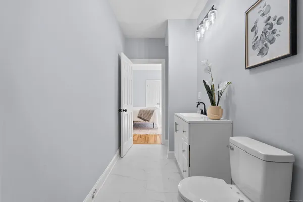 a bathroom with a toilet and a sink