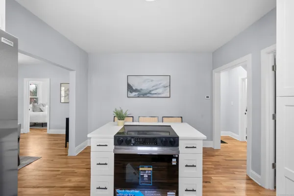 a kitchen with stainless steel appliances granite countertop a stove and a refrigerator
