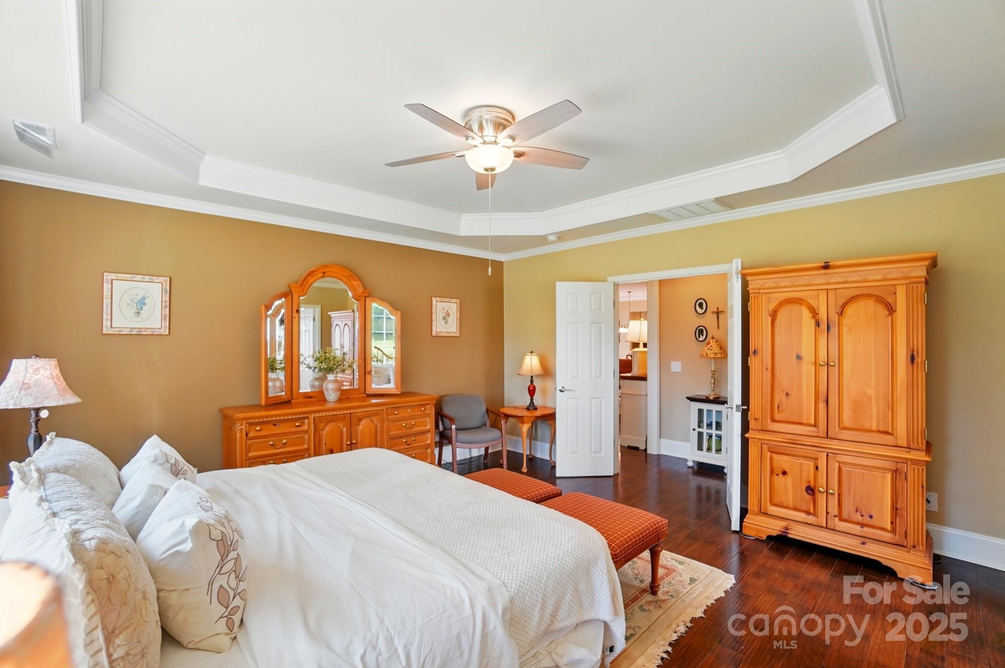 1974 Links View Drive Fort Mill, SC 29707 - Photo 17 of 30 a bedroom with a bed and a chandelier