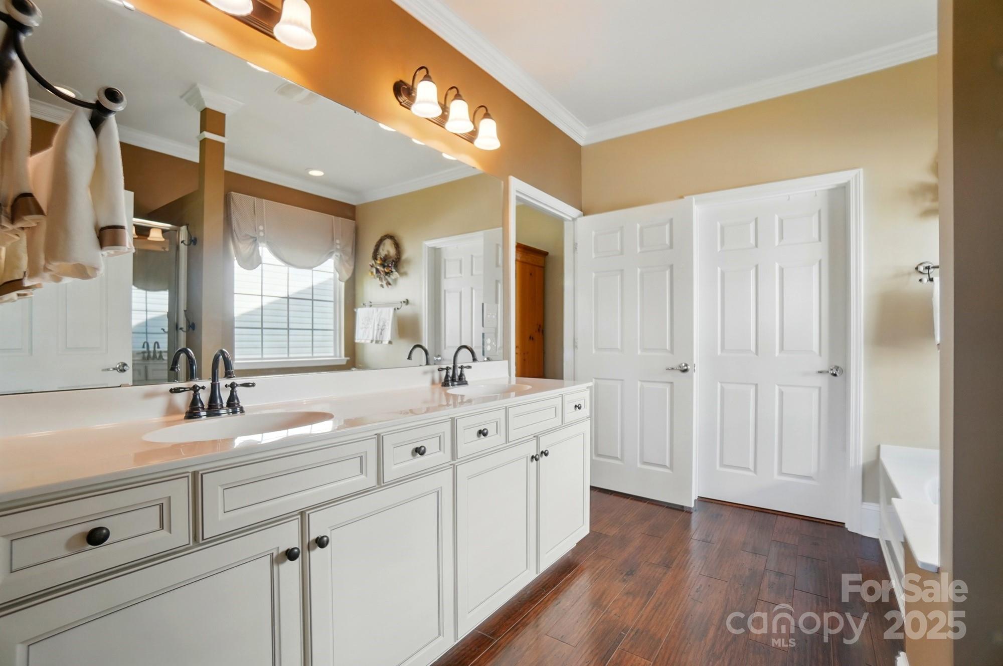 1974 Links View Drive Fort Mill, SC 29707 - Photo 19 of 30 a spacious bathroom with a double vanity sink a mirror and a shower